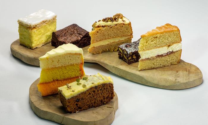 A wide selection of cake is available.